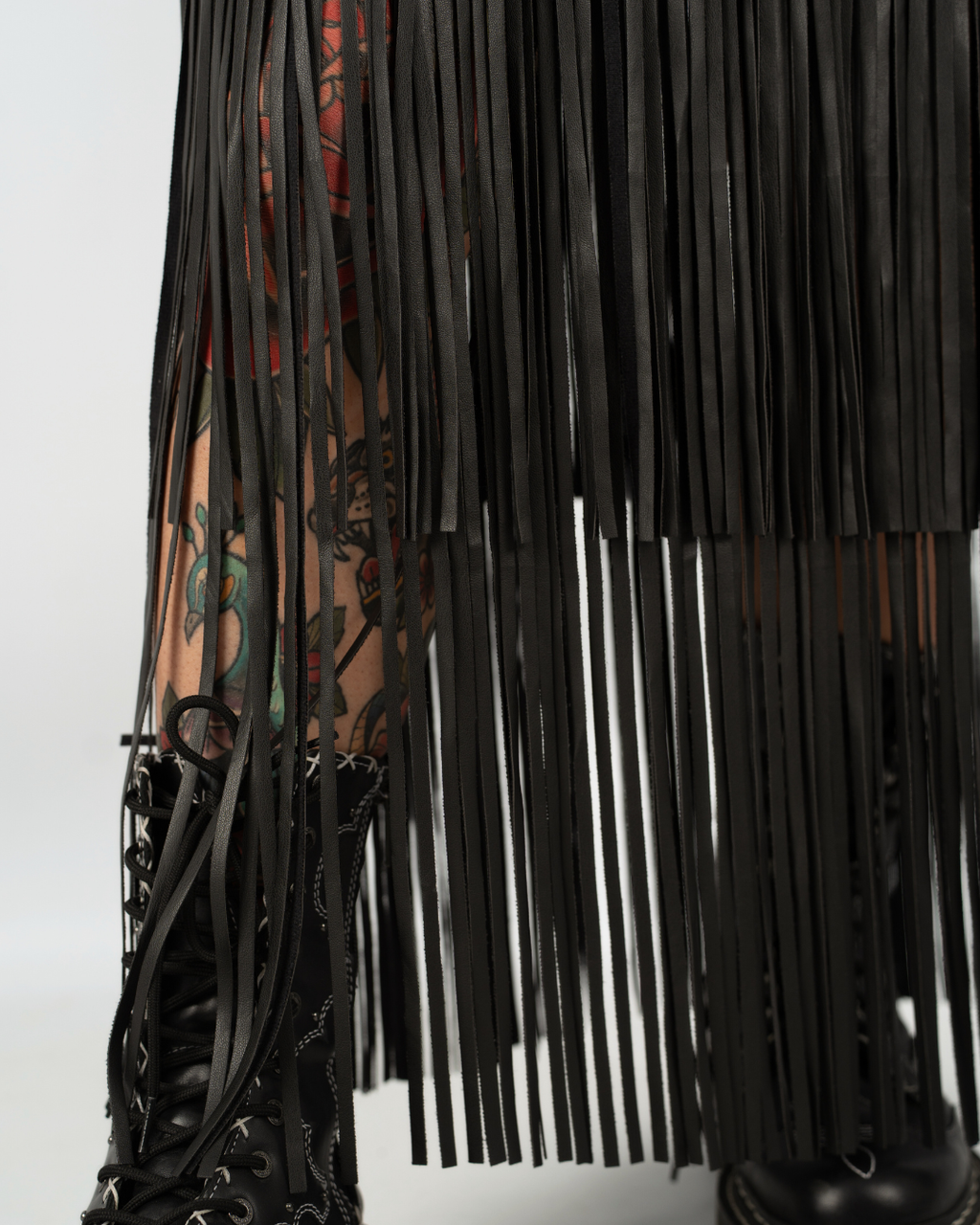 EXTREME WHIPLASH FRINGED FAUX LEATHER SKIRT