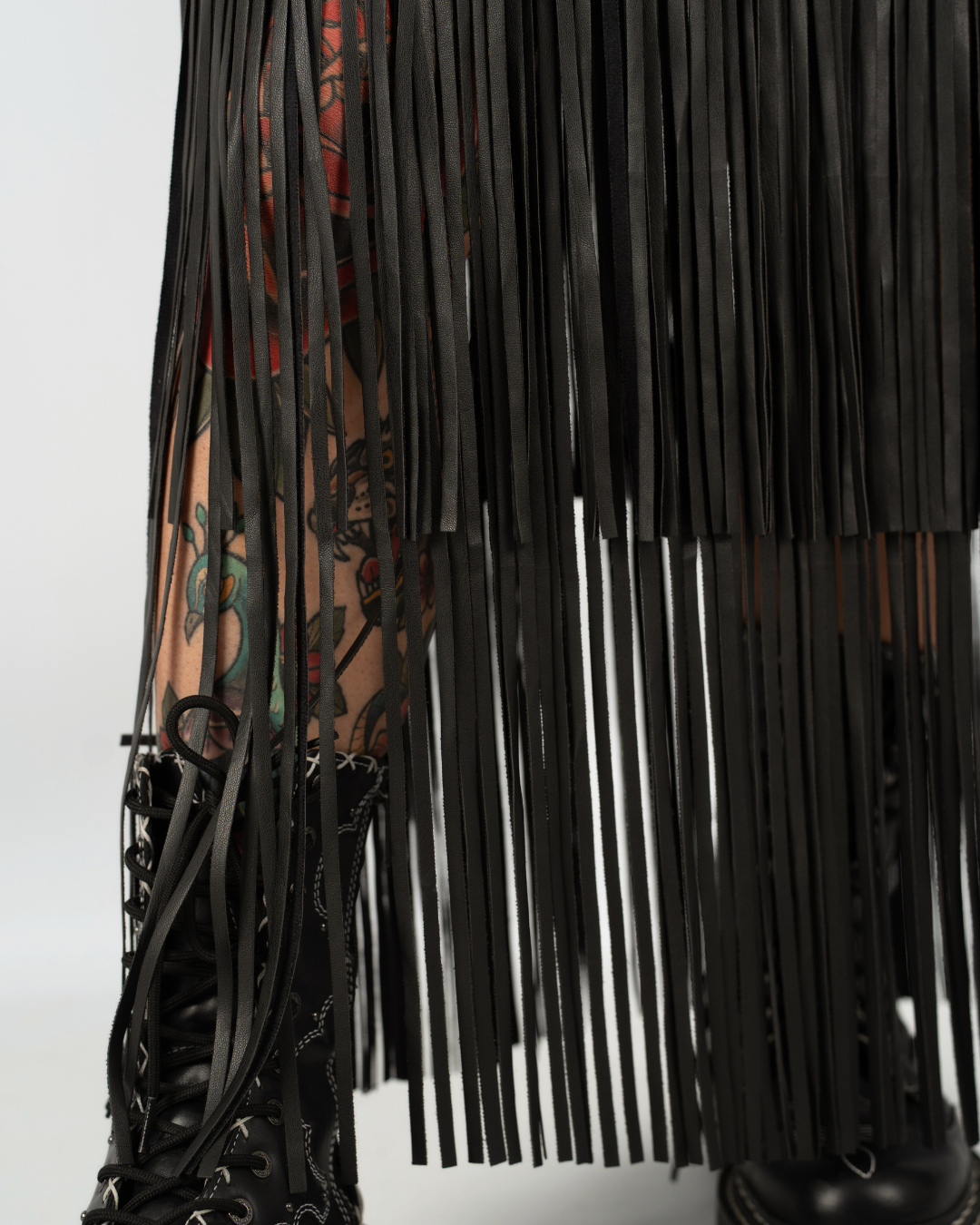 EXTREME WHIPLASH FRINGED FAUX LEATHER SKIRT